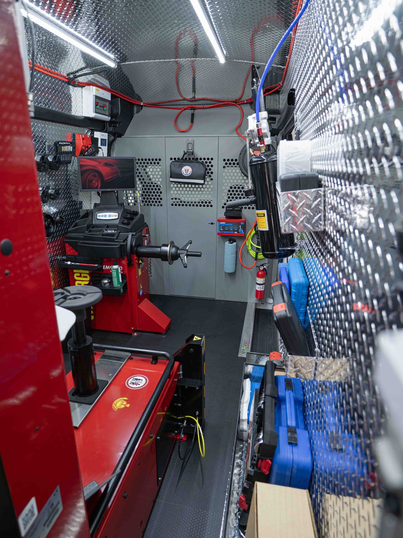 Corghi tire mounting and balancing equipment installed inside the van